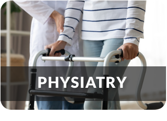 A medical professional assists a young woman in using a walker.